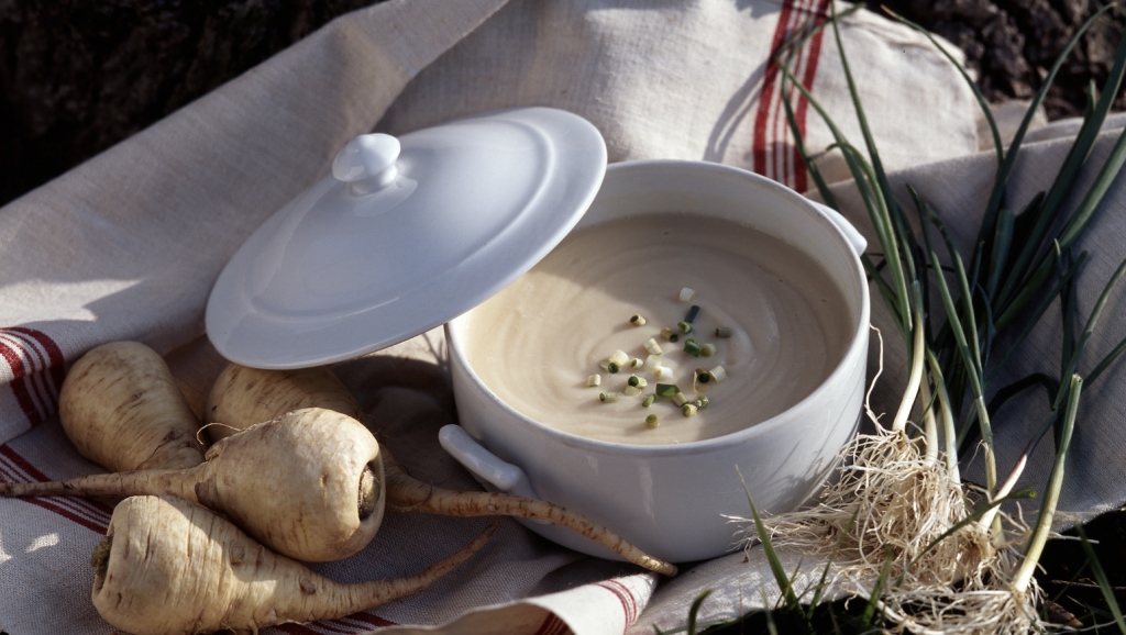 Parsnip and chestnut soup in a white pot