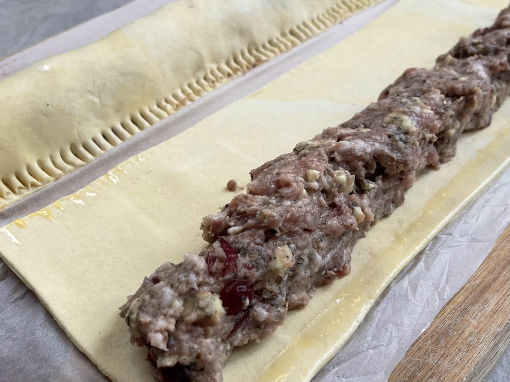 Shaping your blue cheese sausage rolls